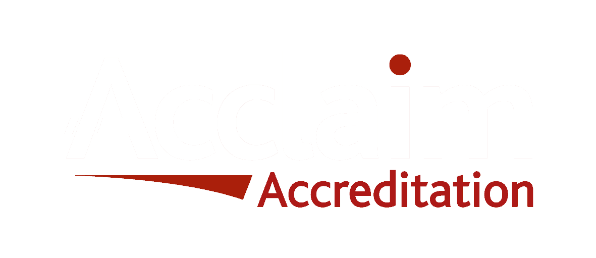 Red accreditation logo with swoosh and dot.